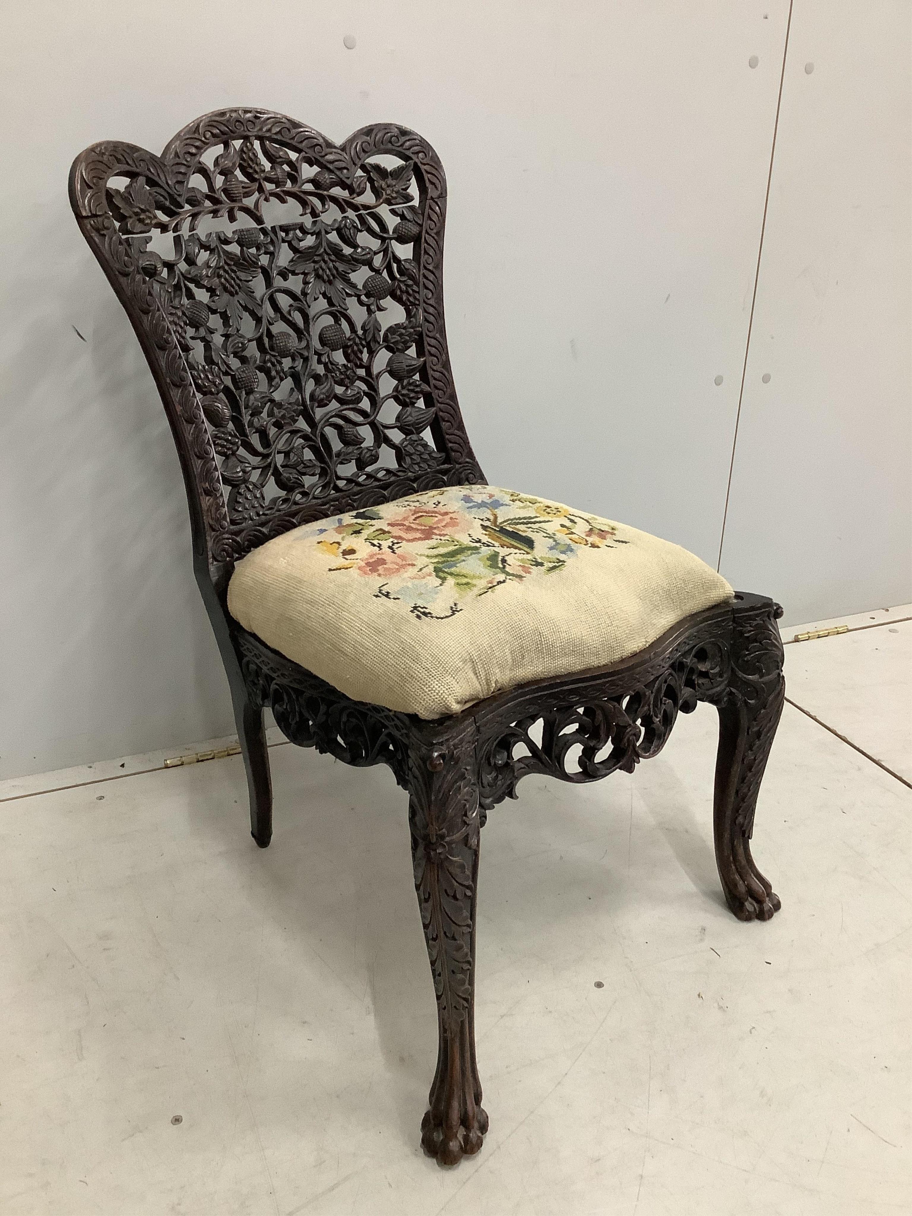 An Anglo Indian carved hardwood side chair with tapestry seat, height 81cm